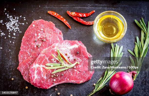 fresh beef steaks with ingredients on the dark background,romania - fillet steak stock pictures, royalty-free photos & images