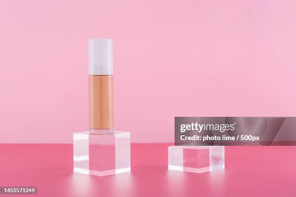 cosmetic liquid foundation nude cream bottle mockup on acrylic block - acrylic glass stock pictures, royalty-free photos & images