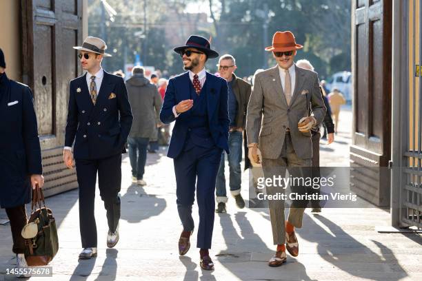 Guest wears blue suit, hat, tie during Pitti Immagine Uomo 103 at Fortezza Da Basso on January 10, 2023 in Florence, Italy.