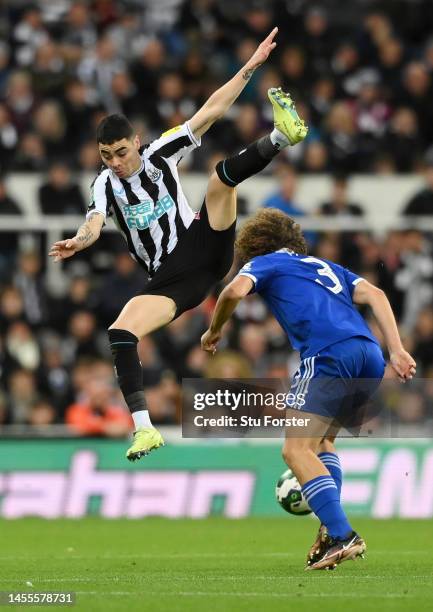 Miguel Almiron of Newcastle United jumps in the air past Wout Faes of Leicester City during the Carabao Cup Quarter Final match between Newcastle...