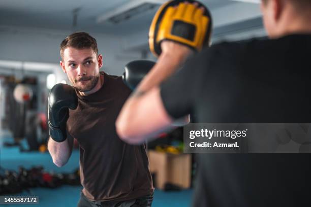 caucasian male boxer working hard - boxing stock pictures, royalty-free photos & images