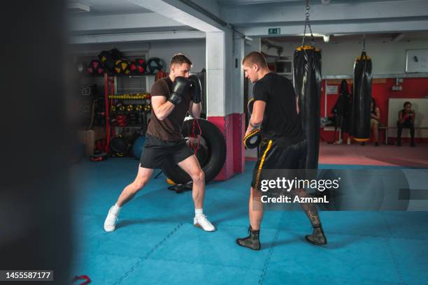 caucasian male boxer working hard - fighting stance stock pictures, royalty-free photos & images