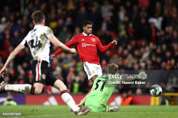 Marcus Rashford of Manchester United scores the team's second goal past Ashley Maynard-Brewer of Charlton Athletic during the Carabao Cup Quarter...