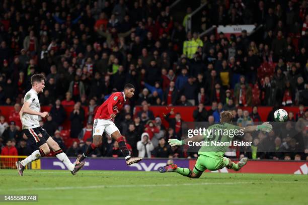 Marcus Rashford of Manchester United scores the team's third goal past Ashley Maynard-Brewer of Charlton Athletic during the Carabao Cup Quarter...