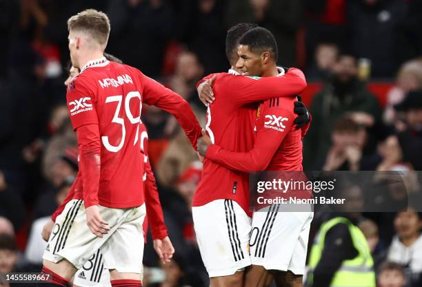 Marcus Rashford of Manchester United celebrates with teammates after scoring the team's third goal during the Carabao Cup Quarter Final match between...