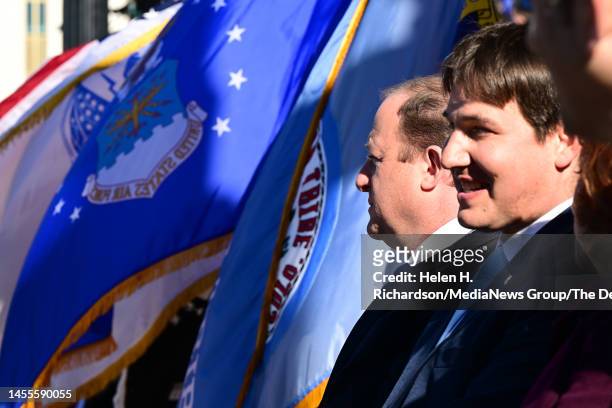 Governor Jared Polis and first gentleman Marlon Reis, right, listen during inauguration day on January 10, 2023 In Denver, Colorado. The 2023...