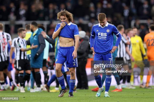 Wout Faes and Harvey Barnes of Leicester City look dejected following their team's defeat in the Carabao Cup Quarter Final match between Newcastle...