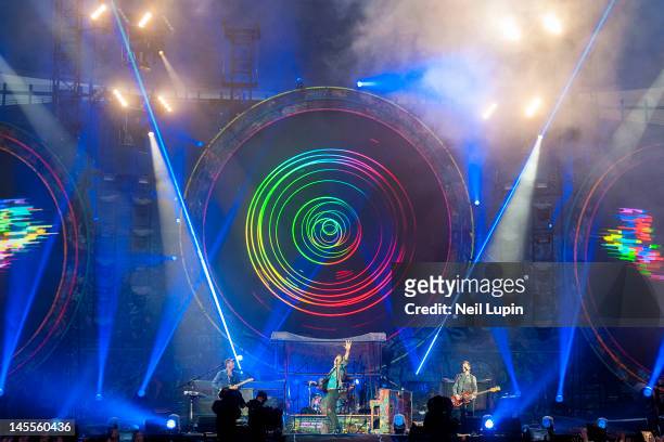 Jonny Buckland, Chris Martin and Guy Berryman of Coldplay perform on stage at Emirates Stadium on June 1, 2012 in London, United Kingdom.