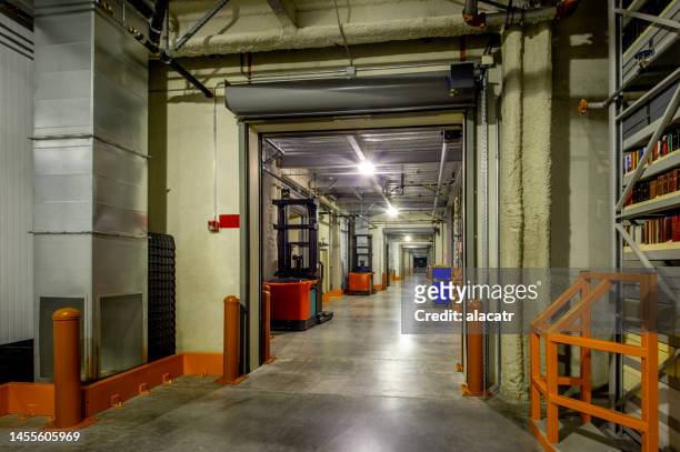 rollup fire doors - industrial doors stock pictures, royalty-free photos & images