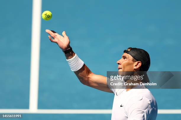 Rafael Nadal of Spain serves during a practice session ahead of the 2023 Australian Open at Melbourne Park on January 11, 2023 in Melbourne,...