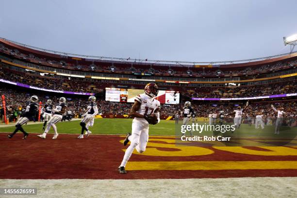 Wide receiver Terry McLaurin of the Washington Commanders celebrates after catching a first quarter touchdown pass against the Dallas Cowboys at...