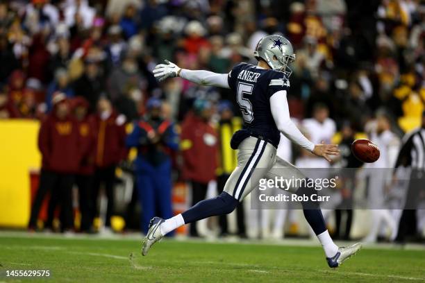 Punter Bryan Anger of the Dallas Cowboys kicks the ball against the Washington Commanders at FedExField on January 08, 2023 in Landover, Maryland.