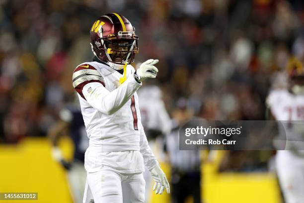 Wide receiver Jahan Dotson of the Washington Commanders celebrates after catching a pass for a first downagainst the Dallas Cowboys at FedExField on...