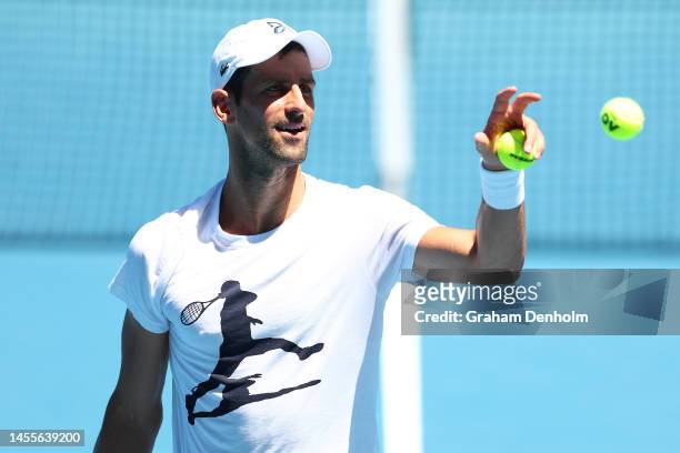 Novak Djokovic of Serbia looks on during a practice match against Daniil Medvedev of Russia ahead of the 2023 Australian Open at Melbourne Park on...