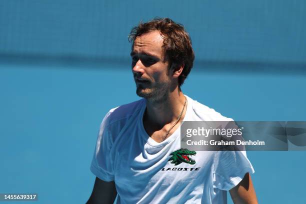 Daniil Medvedev of Russia looks on in a practice match against Novak Djokovic of Serbia ahead of the 2023 Australian Open at Melbourne Park on...