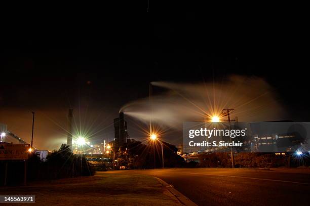 port kembla steel works at night - wollongong stock pictures, royalty-free photos & images