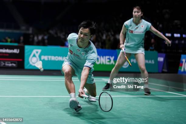 Yuta Watanabe and Arisa Higashino of Japan compete in the Mixed Doubles First Round match against Gregory Mairs and Jenny Moore of England on day two...