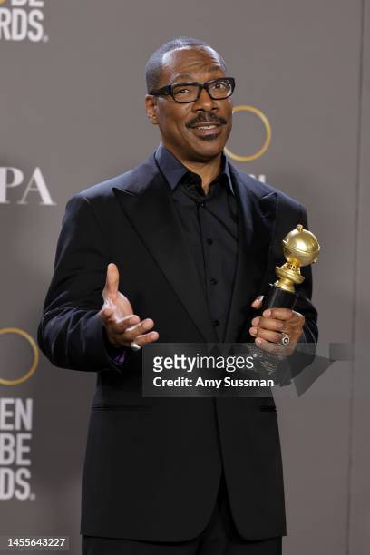 Eddie Murphy poses with the Cecil B. Demille Award in the press room during the 80th Annual Golden Globe Awards at The Beverly Hilton on January 10,...