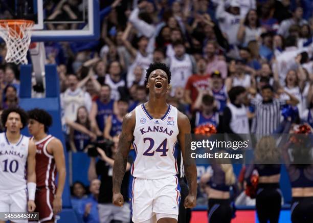 Adams Jr. #24 of the Kansas Jayhawks celebrates a basket by Jalen Wilson during a game against the Oklahoma Sooners in the second half at Allen...