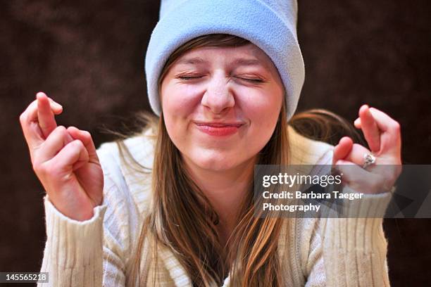 fingers crossed - fortune stockfoto's en -beelden