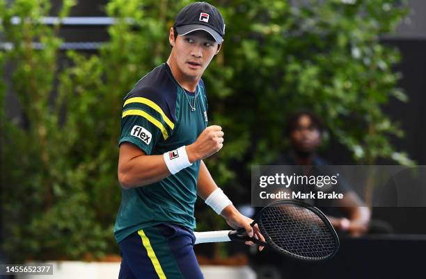 Soonwoo Kwon of Korea celebrates winning a game against Pablo Carreno Busta of Spain during day three of the 2023 Adelaide International at Memorial...