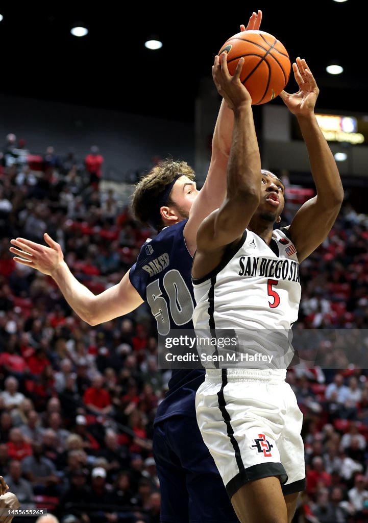 Lamont Butler of the San Diego State Aztecs shoots past the defense