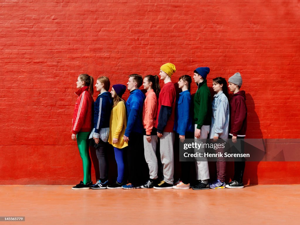 Young people standing against each other