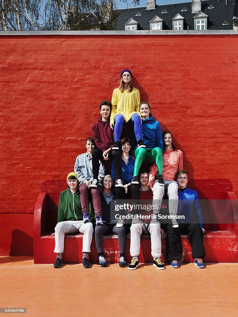 Young people forming a pyramid