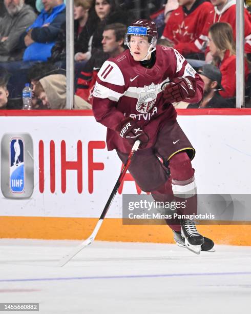 Dans Locmelis of Team Latvia skates during the second period against Team Austria in the relegation round of the 2023 IIHF World Junior Championship...