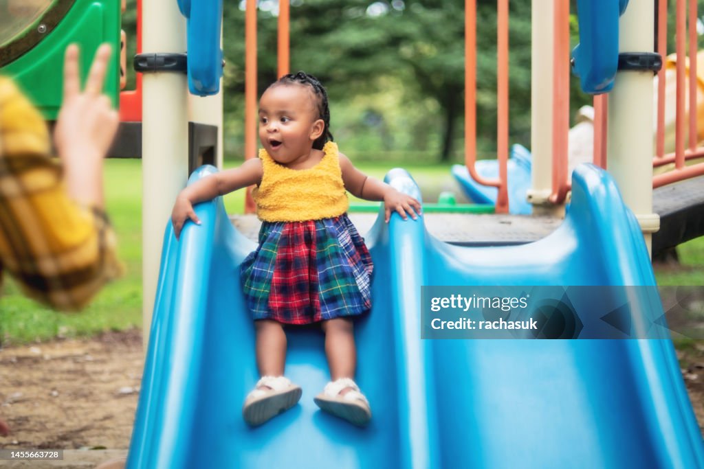 Playing on the Slide in the Park
