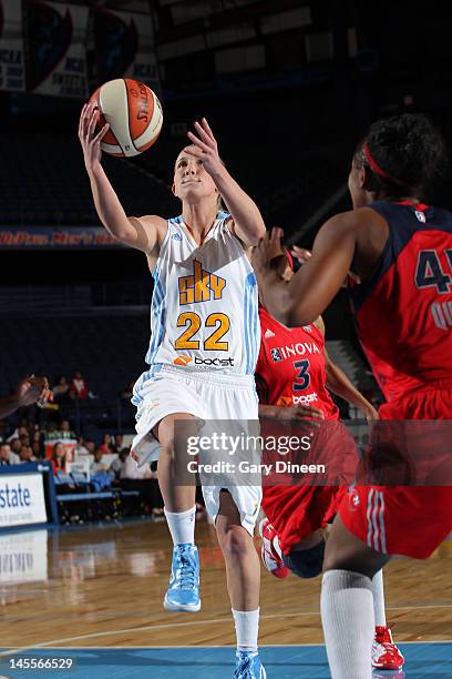 Courtney Vandersloot of the Chicago Sky goes to the basket against Dominique Canty and Noelle Quinn of the Washington Mystics on June 1, 2012 at the...