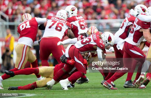 Azeez Al-Shaair and Fred Warner of the San Francisco 49ers tackle Corey Clement of the Arizona Cardinals during the game at Levi's Stadium on January...