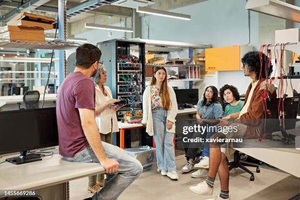 instructor and students in electrical engineering lab - electrical equipment stock pictures, royalty-free photos & images