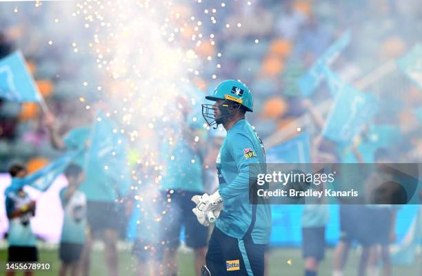 Usman Khawaja of the Heat enters the field of play to open the batting during the Men's Big Bash League match between the Brisbane Heat and the Perth...