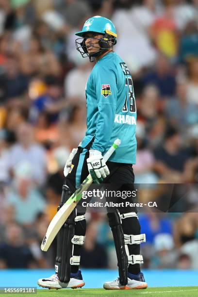 Usman Khawaja of the Heat leaves the field after getting dismissed during the Men's Big Bash League match between the Brisbane Heat and the Perth...