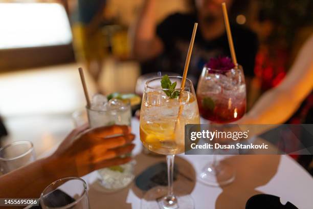 friends hanging out and drinking cocktails - coctail party stock pictures, royalty-free photos & images