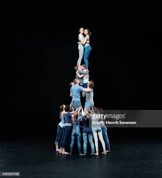 human tower - acrobatics gymnastics stockfoto's en -beelden