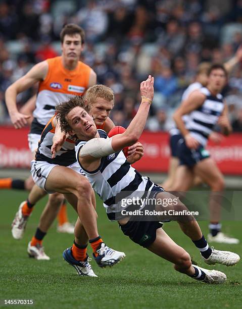 Billie Smedts of the Cats looks to get away from his opponent during the round 10 AFL match between the Geelong Cats and the Greater Western Sydney...