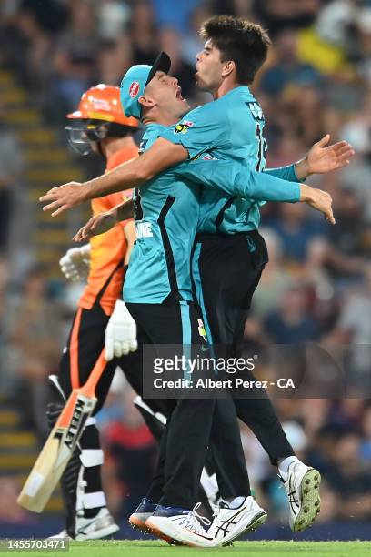 Xavier Bartlett of the Heat celebrates with Marnus Labuschagne after dismissing Cameron Bancroft of the Scorchers during the Men's Big Bash League...