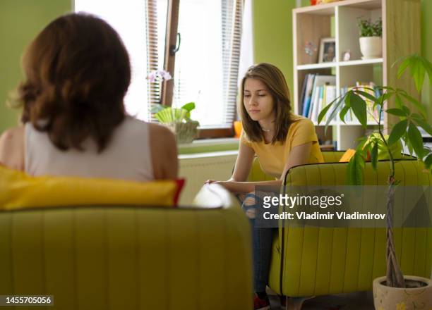 a sad teenager looking during a psychological therapy - anorexia nervosa stock pictures, royalty-free photos & images