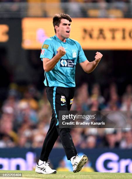 Xavier Bartlett of the Heat celebrates taking the wicket of Cameron Bancroft of the Scorchers during the Men's Big Bash League match between the...