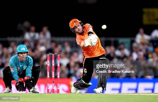 Josh Inglis of the Scorchers hits the ball over the boundary for a six during the Men's Big Bash League match between the Brisbane Heat and the Perth...