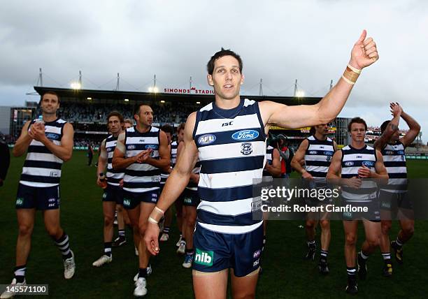Harry Taylor of the Cats acknowledges the crowd after playing his 100th match after the Cats defeated the Giants at the round 10 AFL match between...
