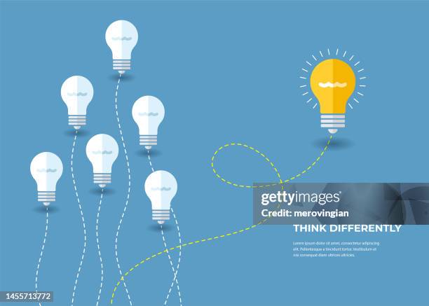 bright light bulb symbol representing a new invention. think differently, standing out from the crowd - ideas stock illustrations