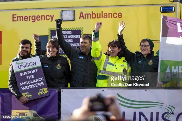 Ambulance service workers and Unison U.K. Public-sector union members join a picket line outside the London Ambulance Service headquarters in...