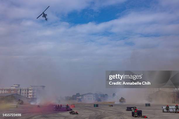 Bell AH-1 Super Cobra flies over during the two-day routine drill to show combat readiness ahead of Lunar New Year holidays at a military base on...