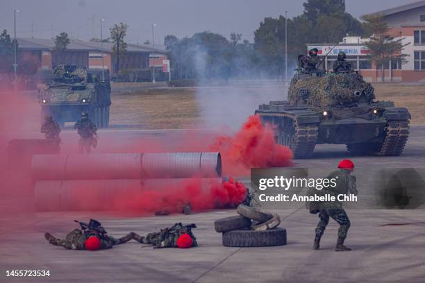 Soldiers manoeuvre to secure the perimeter during the two-day routine drills to show combat readiness ahead of Lunar New Year holidays at a military...