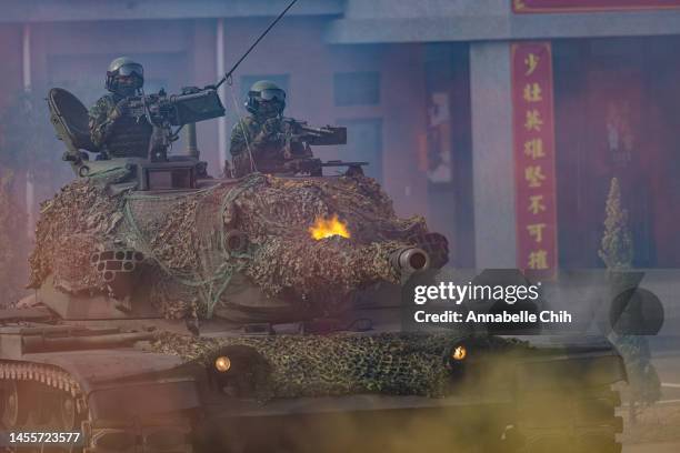 Soldiers fire on a CM-11 Brave Tiger battle tank during the two-day routine drills to show combat readiness ahead of Lunar New Year holidays at a...