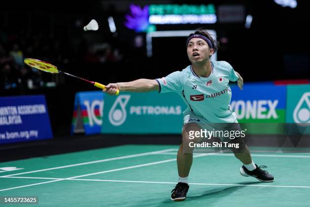 Kodai Naraoka of Japan competes in the Men's Singles First Round match against Lee Zii Jia of Malaysia on day two of PETRONAS Malaysia Open at Axiata...