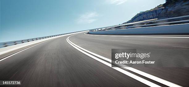 ocean cliff road - crash barrier stock pictures, royalty-free photos & images